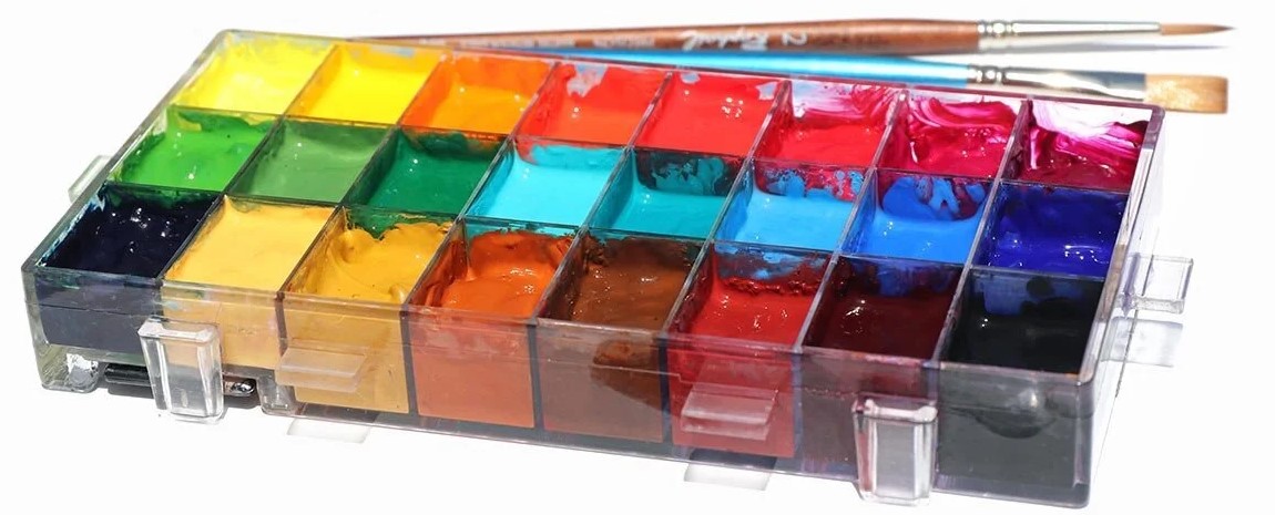Gouache color swatches in a sealed palette box showing vivid opaque pigments