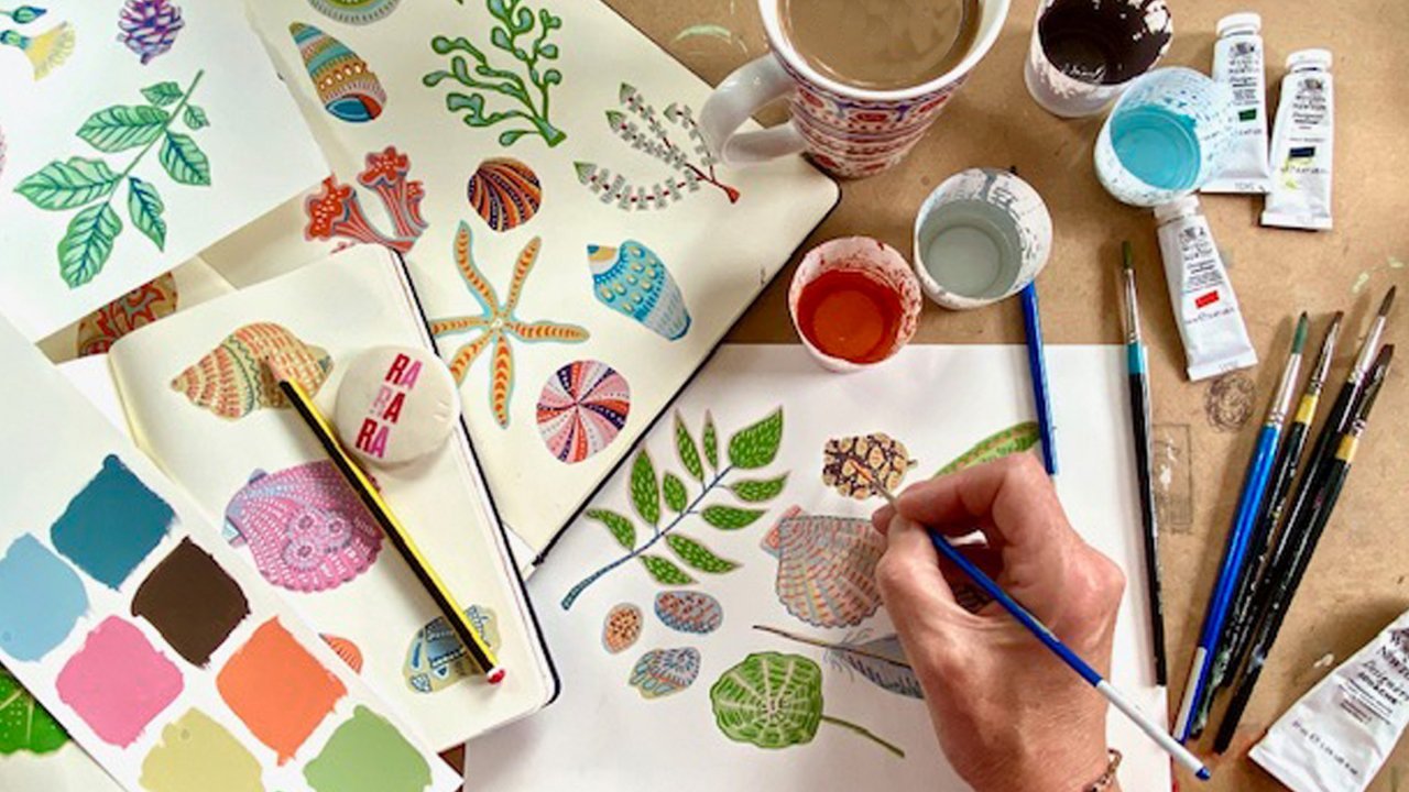 Artist demonstrating gouache painting techniques with layered flat color on watercolor paper